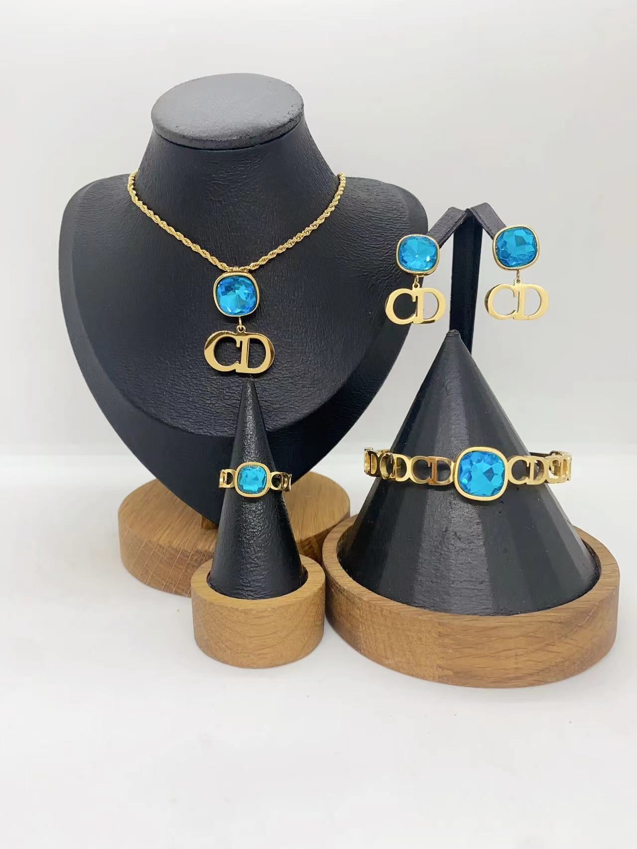 Elegant Gold Crystal Letter Charm Jewelry Set – Necklace, Earrings, Bracelet & Ring